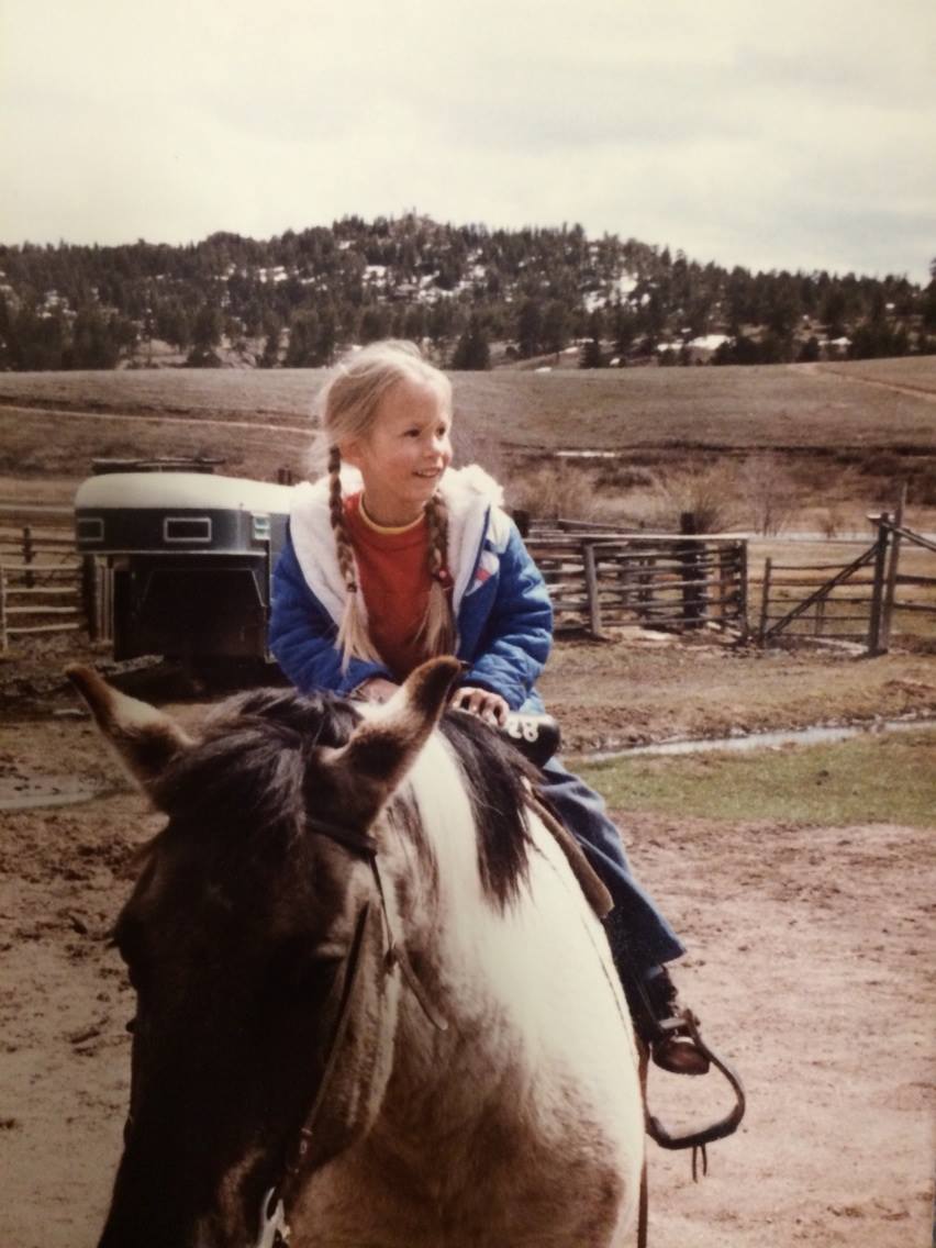 Young Jennifer Jarvis on horseback in Wyoming